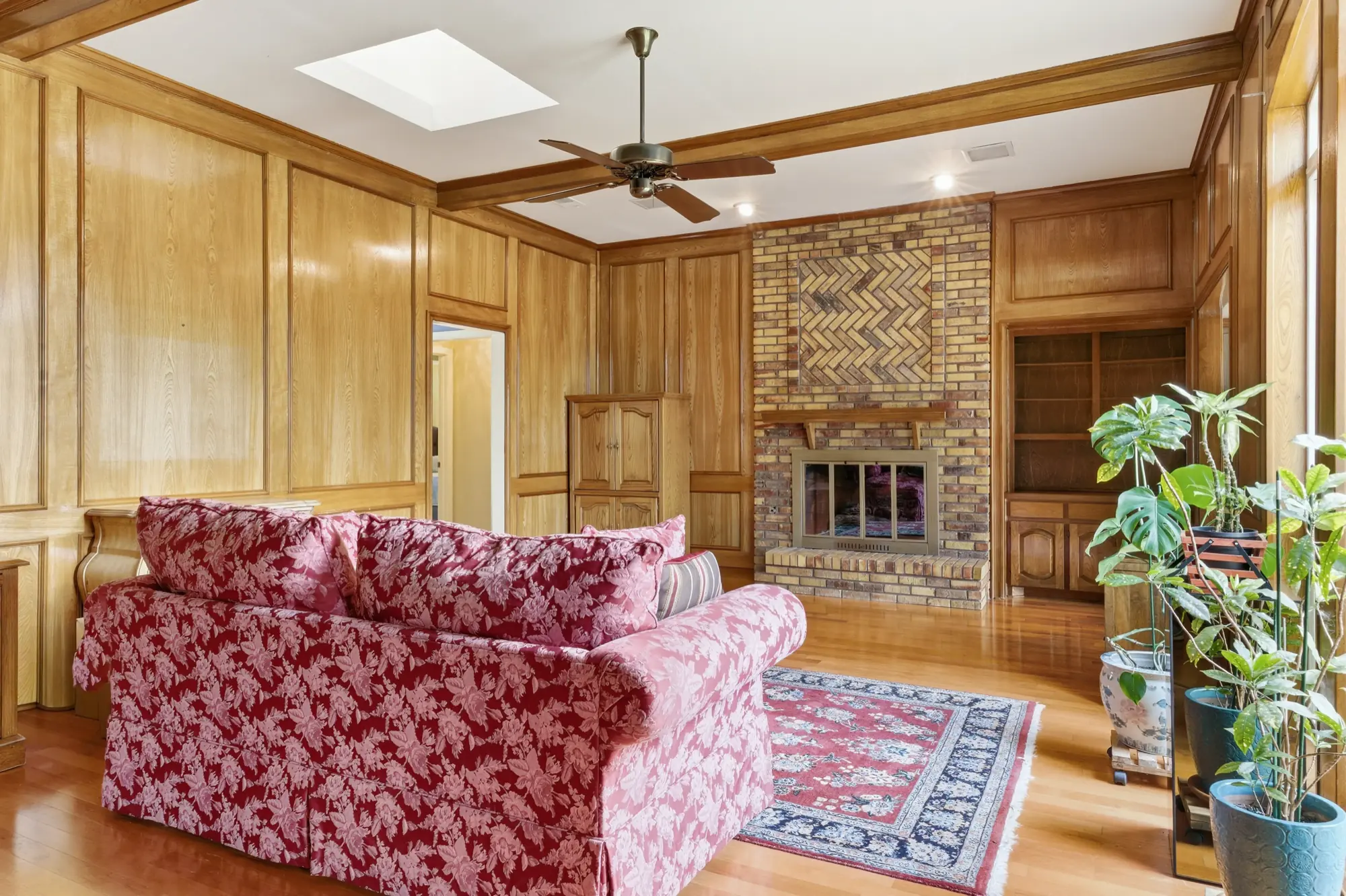 Living room with brick fireplace
